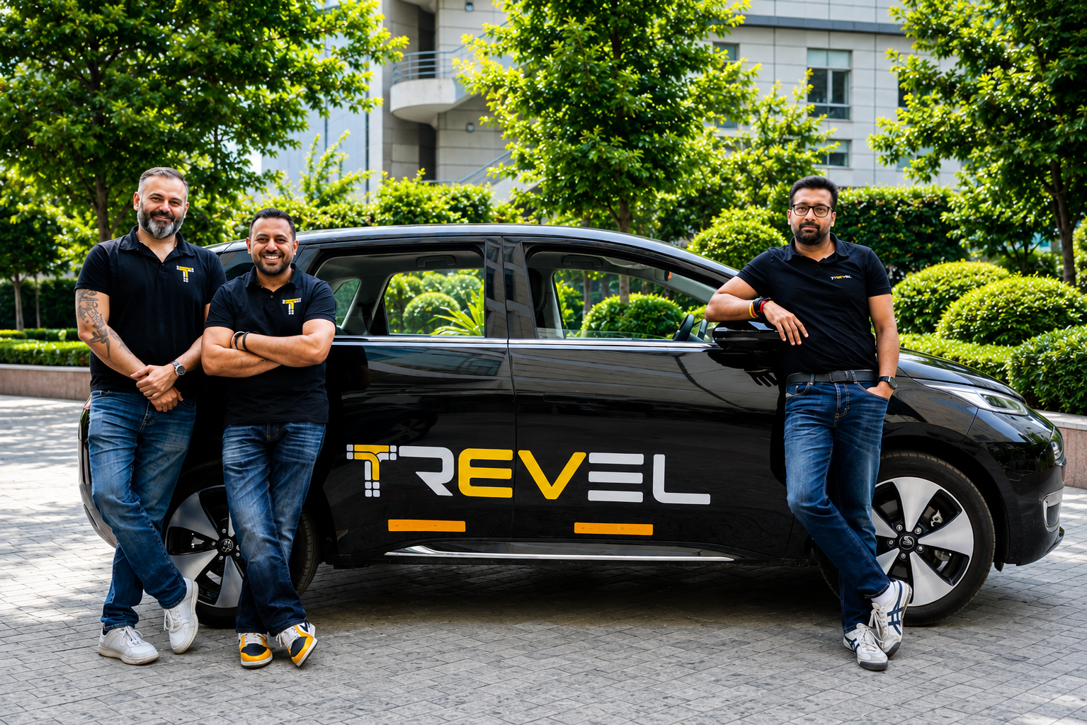 Trevel founders Mishu Ahluwalia, Rishi Raj Kochhar and Sahil Jindal with a branded Trevel electric SUV in Gurugram