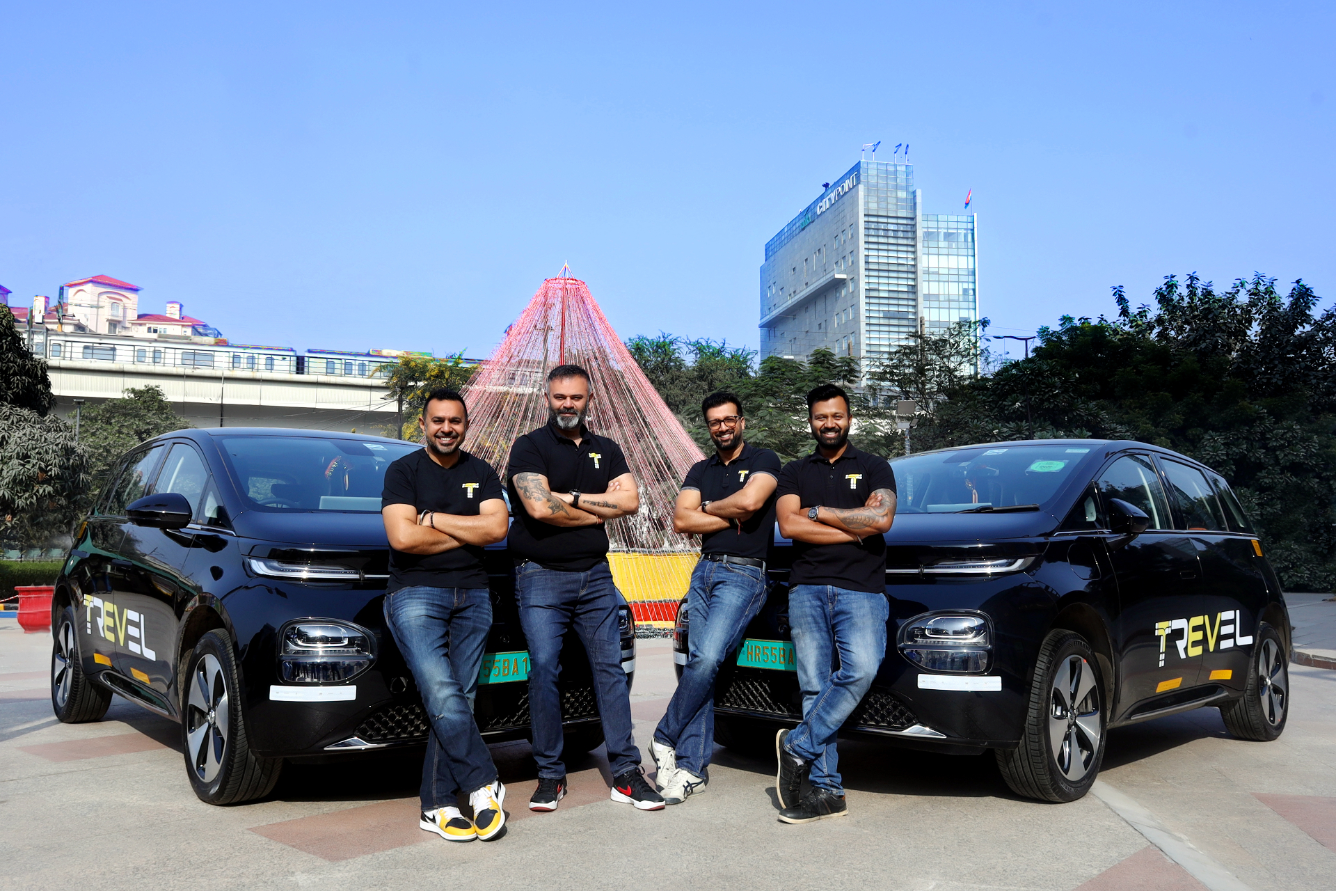 Trevel founders Sahil Jindal, Mishu Ahluwalia, Nagarjun K R, and Rishi Raj Kochhar with Trevel EV cabs